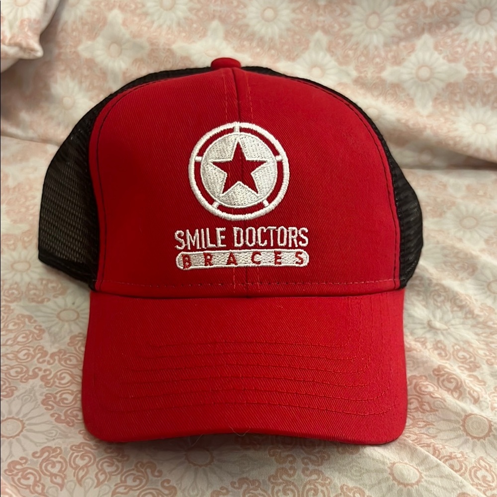 Red Smile Doctors Trucker Hat